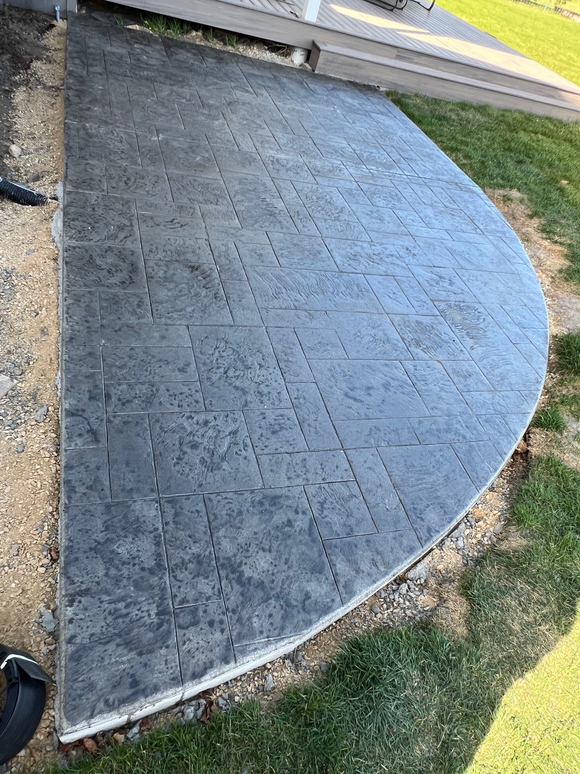 Gallery photos for Stamped Concrete Hot Tub Pad Turns Bare Backyard Into Usable Space: Image #2