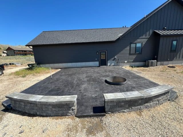 Dark Stamped Concrete Patio with Fire Pit image