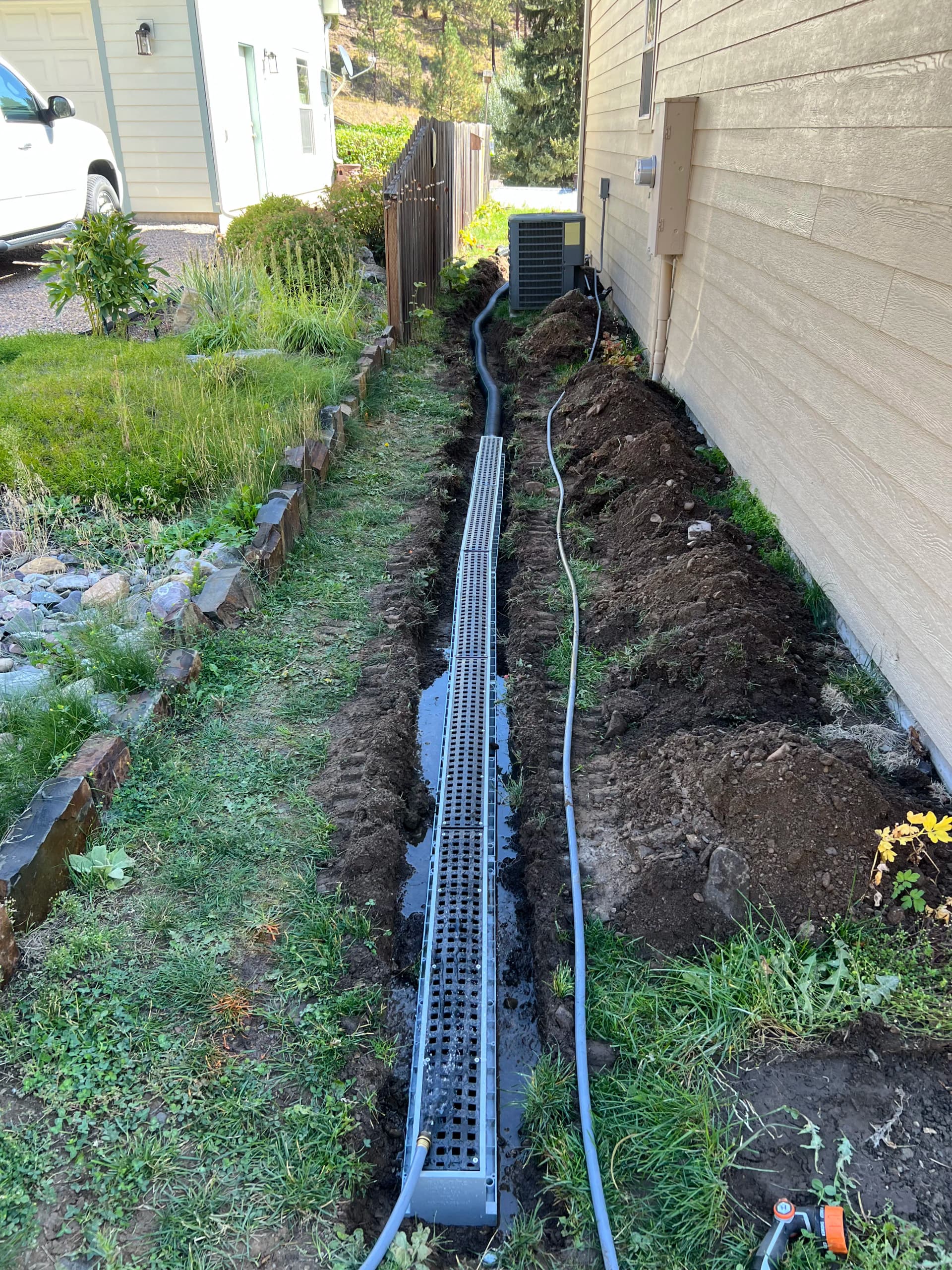 Gallery photos for Water Mitigation Done Right - Drainage Channel and Dry Well Install: Image #1